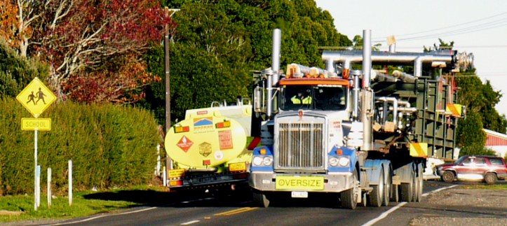 Oversized trucks on Inland North Road near Tikorangi school (photo by Fiona Clark, June 2013)